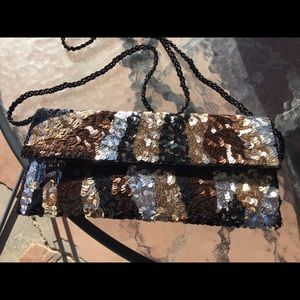 Envelope style clutch with beaded handle